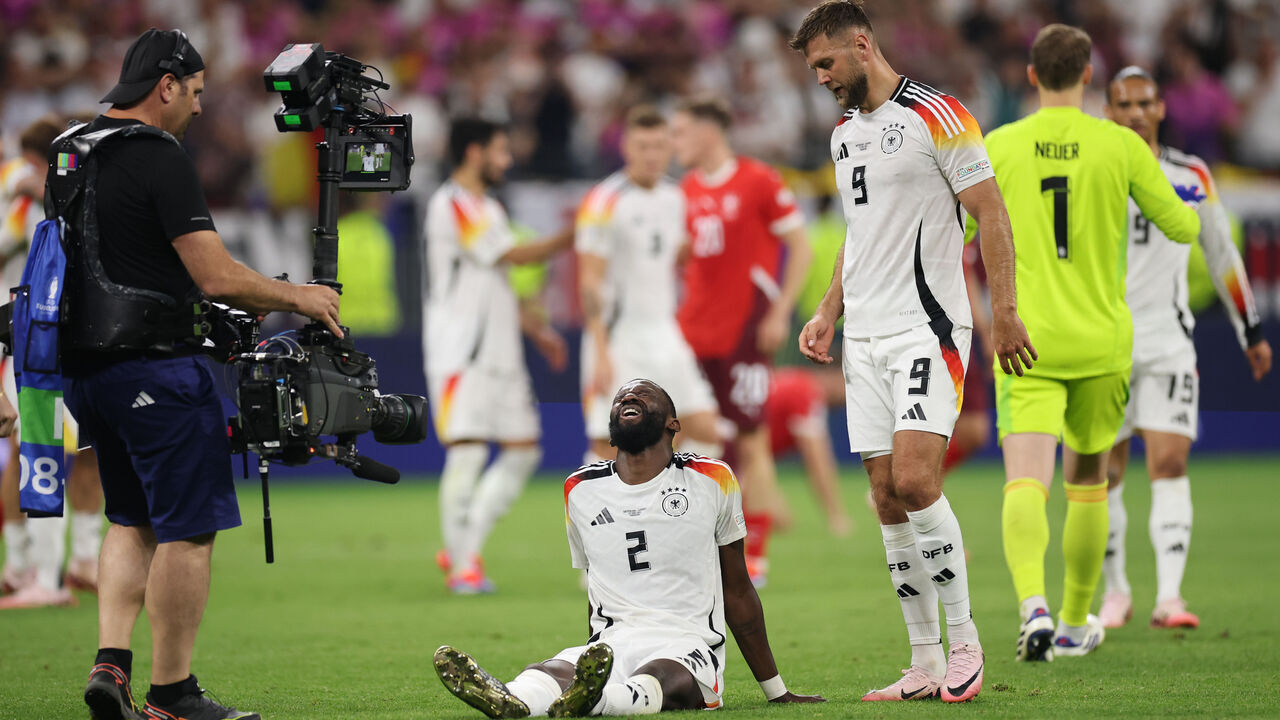 FRANKFURT AM MAIN, GERMANY - JUNE 23: Antonio Ruediger and Niklas Fuellkrug of Germany react after the UEFA EURO 2024 group stage match between Switzerland and Germany at Frankfurt Arena on June 23, 2024 in Frankfurt am Main, Germany.