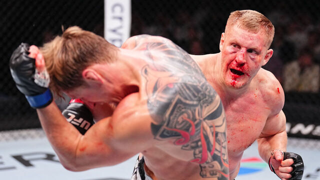 RIYADH, SAUDI ARABIA - JUNE 22: (R-L) Sergei Pavlovich of Russia punches Alexander Volkov of Russia in a heavyweight fight during the UFC Fight Night event at Kingdom Arena on June 22, 2024 in Riyadh, Saudi Arabia.