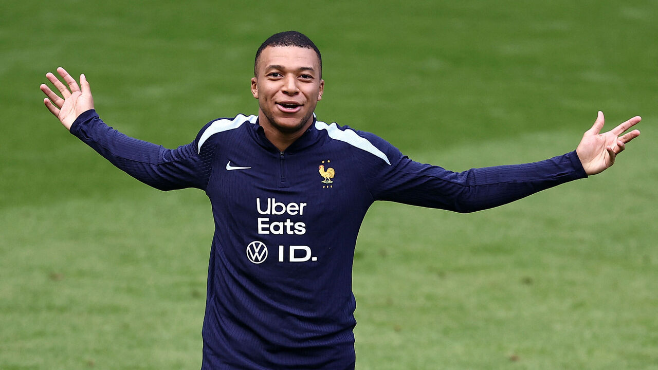 France's forward #10 Kylian Mbappe gestures during a training session within the UEFA Euro 2024 Football Championship at the Home Deluxe Arena Stadium in Paderborn, western Germany, on June 23, 2024.