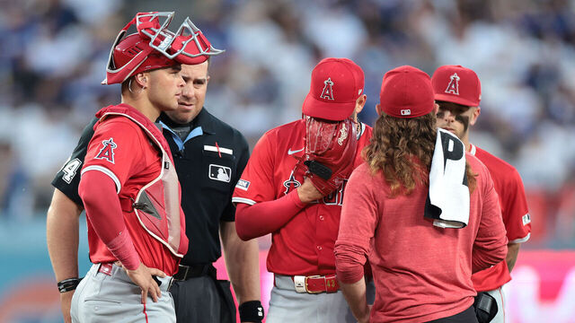 LOS ANGELES, CALIFORNIA- Angels pitcher Patrick Sandoval, center, comes out of the game in the third inning against the Dodgers at Dodgers Stadium Friday. (Wally Skalij/Los Angeles Times via Getty Images)1461942