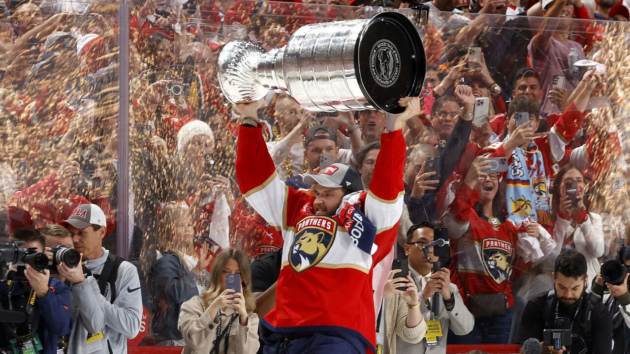 SUNRISE, FLORIDA - JUNE 24: Aleksander Barkov #16 of the Florida Panthers lifts the Stanley Cup after Florida's 2-1 victory against the Edmonton Oilers in Game Seven of the 2024 Stanley Cup Final at Amerant Bank Arena on June 24, 2024 in Sunrise, Florida.