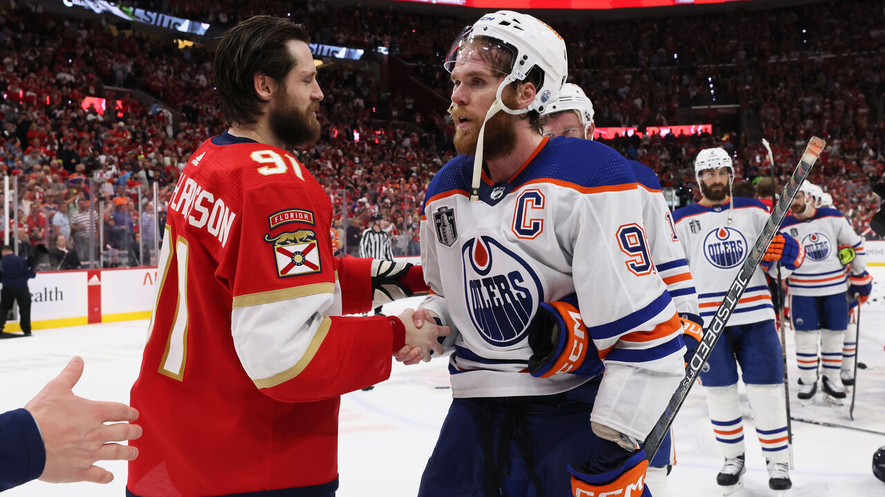 SUNRISE, FLORIDA - JUNE 24: Oliver Ekman-Larsson #91 of the Florida Panthers shakes hands with Connor McDavid #97 of the Edmonton Oilers after Florida's 2-1 victory in Game Seven of the 2024 Stanley Cup Final at Amerant Bank Arena on June 24, 2024 in Sunrise, Florida.