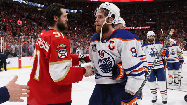 SUNRISE, FLORIDA - JUNE 24: Oliver Ekman-Larsson #91 of the Florida Panthers shakes hands with Connor McDavid #97 of the Edmonton Oilers after Florida's 2-1 victory in Game Seven of the 2024 Stanley Cup Final at Amerant Bank Arena on June 24, 2024 in Sunrise, Florida.