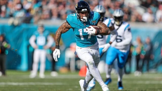 JACKSONVILLE, FLORIDA - DECEMBER 31: Evan Engram #17 of the Jacksonville Jaguars catches a pass against the Carolina Panthers during the first half of the game at EverBank Stadium on December 31, 2023 in Jacksonville, Florida.