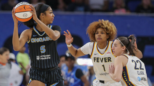 CHICAGO, IL - JUNE 23: Angel Reese #5 of the Chicago Sky is doubled teamed by Caitlin Clark #22 of the Indiana Fever and NaLyssa Smith #1 of the Indiana Fever during the first half on June 23, 2024 at Wintrust Arena in Chicago, Illinois.