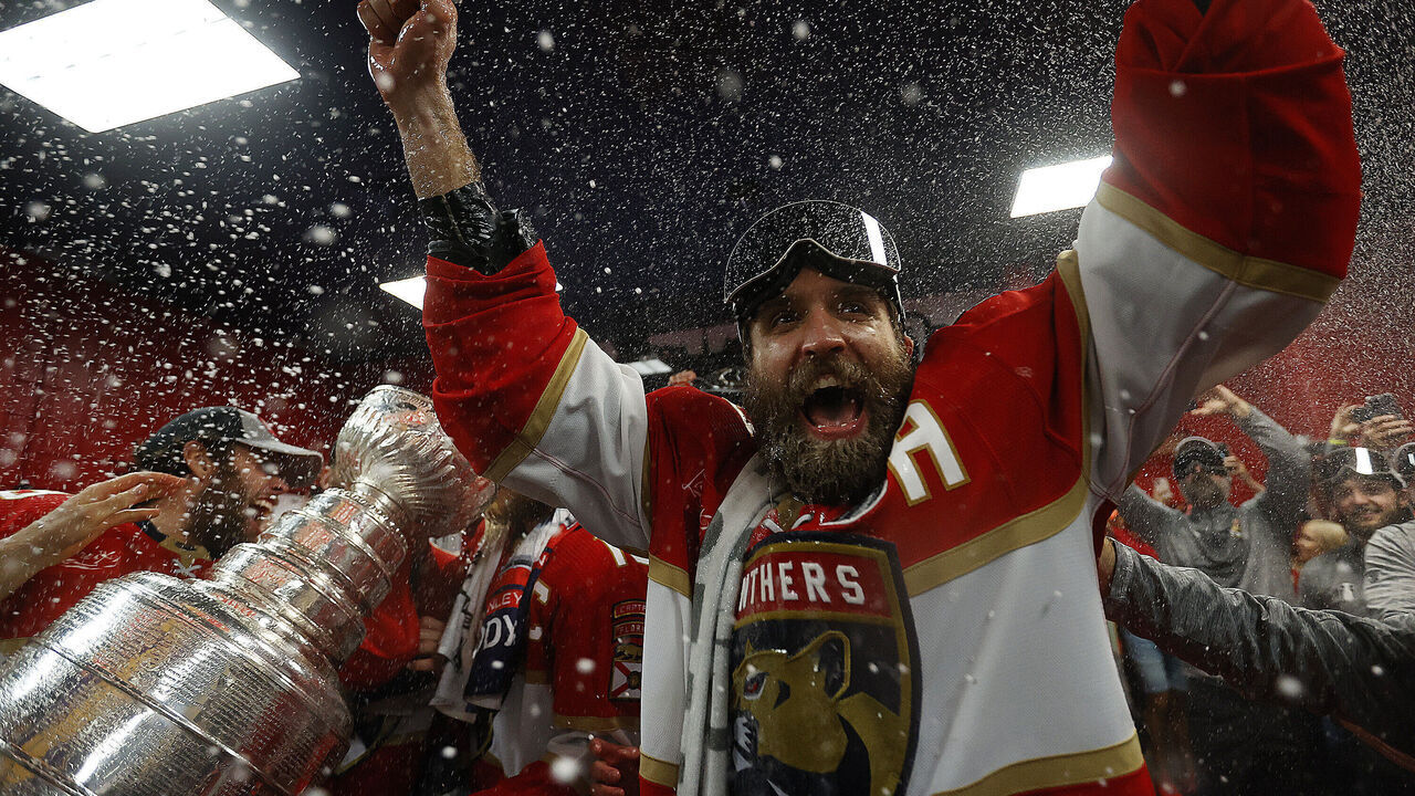 SUNRISE, FLORIDA - JUNE 24: Aaron Ekblad #5 of the Florida Panthers celebrates in the dressing room after beating the Edmonton Oilers in Game Seven of the Stanley Cup Final at the Amerant Bank Arena on June 24, 2024 in Sunrise, Florida.