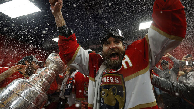 SUNRISE, FLORIDA - JUNE 24: Aaron Ekblad #5 of the Florida Panthers celebrates in the dressing room after beating the Edmonton Oilers in Game Seven of the Stanley Cup Final at the Amerant Bank Arena on June 24, 2024 in Sunrise, Florida.