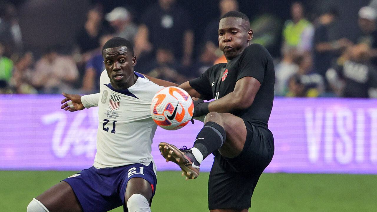 LAS VEGAS, NEVADA - JUNE 18: Timothy Weah #21 of the United States and Kamal Miller #4 of Canada vie for the ball in the first half of the 2023 CONCACAF Nations League Final at Allegiant Stadium on June 18, 2023 in Las Vegas, Nevada. The United States defeated Canada 2-0.