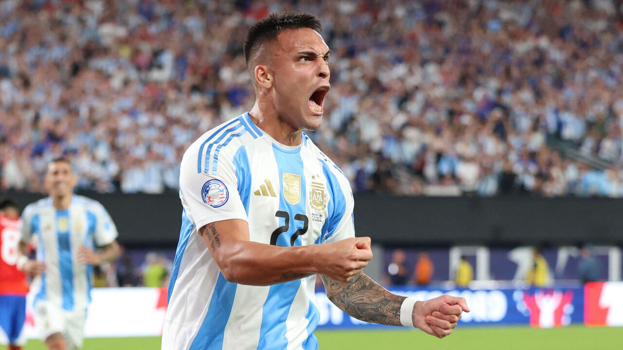 Argentina's forward #22 Lautaro Martinez celebrates after scoring a goal during the Conmebol 2024 Copa America tournament group A football match between Chile and Argentina at MetLife Stadium in East Rutherford, New Jersey on June 25, 2024.