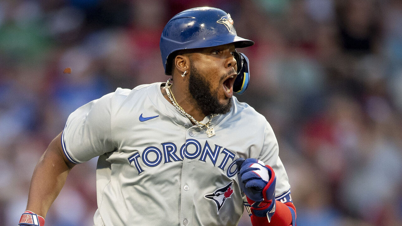 BOSTON, MA - JUNE 25: Vladimir Guerrero Jr. #27 of the Toronto Blue Jays reacts after hitting an RBI double during the third inning of a game against the Boston Red Sox on June 25, 2024 at Fenway Park in Boston, Massachusetts.