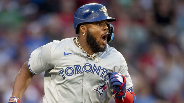 BOSTON, MA - JUNE 25: Vladimir Guerrero Jr. #27 of the Toronto Blue Jays reacts after hitting an RBI double during the third inning of a game against the Boston Red Sox on June 25, 2024 at Fenway Park in Boston, Massachusetts.