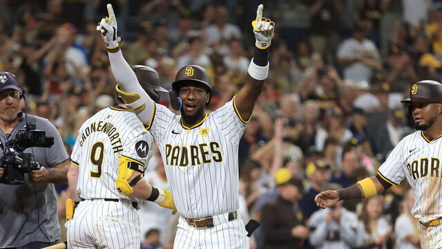 SAN DIEGO, CALIFORNIA - JUNE 25: Jurickson Profar #10 of the San Diego Padres reacts after hitting a grand slam as he returns to the dugout during the sixth inning of a game against the Washington Nationals at Petco Park on June 25, 2024 in San Diego, California.