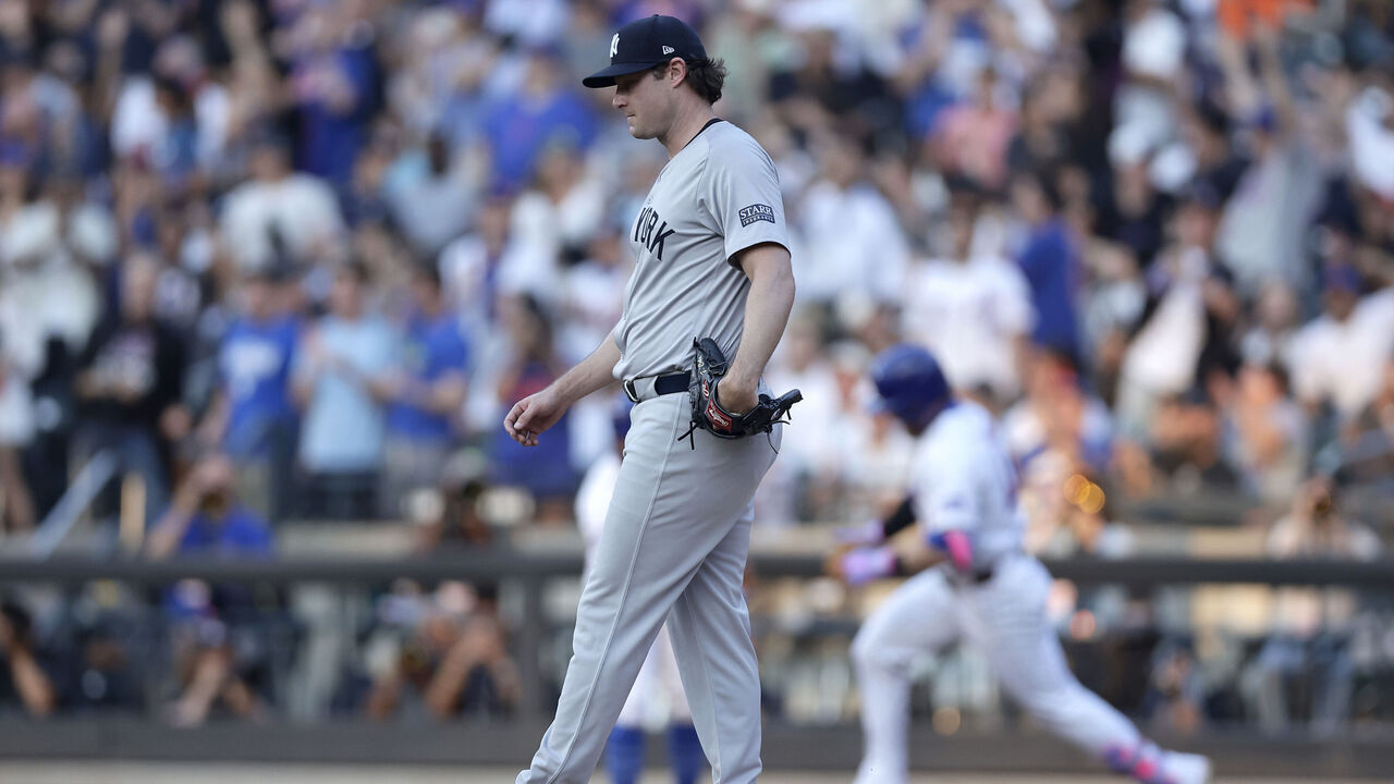 NEW YORK, NEW YORK - JUNE 25: Gerrit Cole #45 of the New York Yankees looks on from the mound after surrendering a second inning home run against Harrison Bader #44 of the New York Mets at Citi Field on June 25, 2024 in New York City.