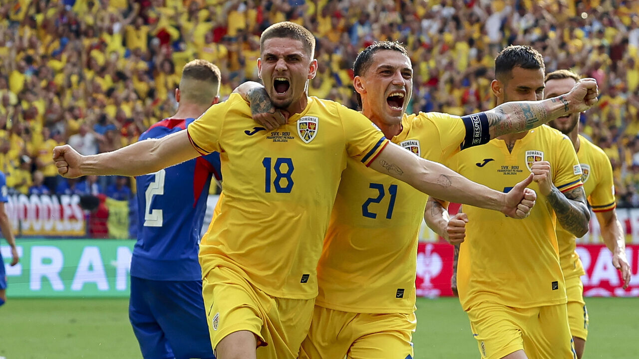 FRANKFURT AM MAIN, GERMANY - JUNE 26: Razvan Marin of Romania celebrates after scoring his teams first goal with Nicolae Stanciu of Romania during the UEFA EURO 2024 group stage match between Slovakia and Romania at Frankfurt Arena on June 26, 2024 in Frankfurt am Main, Germany.