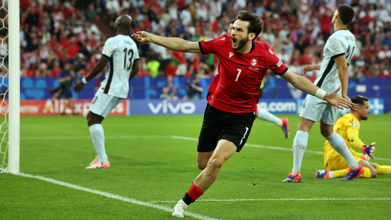 GELSENKIRCHEN, GERMANY - JUNE 26: Khvicha Kvaratskhelia of Georgia celebrates after he scores the opening goal during the UEFA EURO 2024 group stage match between Georgia and Portugal at Arena AufSchalke on June 26, 2024 in Gelsenkirchen, Germany.