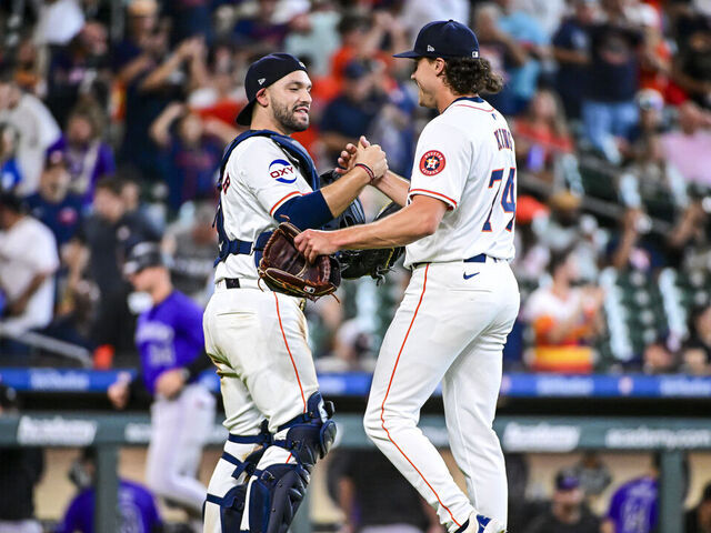 HOUSTON, TEXAS - JUNE 26: Bryan King #74 celebrates with César Salazar #18 of the Houston Astros in the ninth inning after pitching against the Colorado Rockies at Minute Maid Park on June 26, 2024 in Houston, Texas.