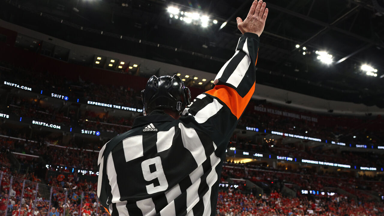SUNRISE, FLORIDA - JUNE 24: Referee Dan O'Rourke #9 raises his arm to make a call during the first period of Game Seven of the 2024 Stanley Cup Final between the Edmonton Oilers and the Florida Panthers at Amerant Bank Arena on June 24, 2024 in Sunrise, Florida.