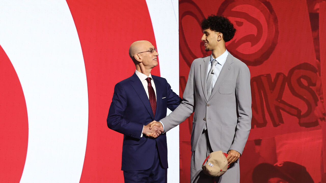 NEW YORK, NEW YORK - JUNE 26: Zaccharie Risacher (R) Shakes hands with NBA commissioner Adam Silver (L) after being drafted first overall pick by the Atlanta Hawks during the first round of the 2024 NBA Draft at Barclays Center on June 26, 2024 in the Brooklyn borough of New York City.