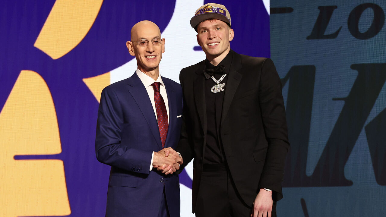 NEW YORK, NEW YORK - JUNE 26: Dalton Knecht (R) shakes hands with NBA commissioner Adam Silver (L) after being drafted 17th overall by the Los Angeles Lakers during the first round of the 2024 NBA Draft at Barclays Center on June 26, 2024 in the Brooklyn borough of New York City.