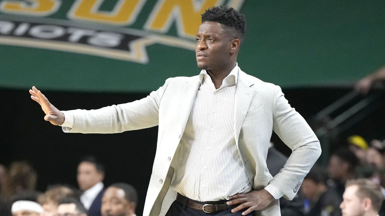 FAIRFAX, VA - MARCH 09: Head coach Tony Skinn of the George Mason Patriots signals to his players during a college basketball game against the Richmond Spiders at Eagle Bank Arena on March 9, 2024 in Fairfax, Virginia.