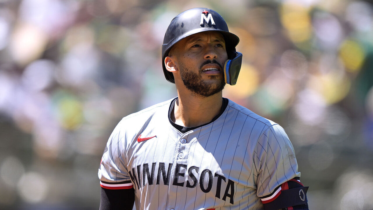 OAKLAND, CALIFORNIA - JUNE 23: Carlos Correa #4 of the Minnesota Twins walks back to the dugout after striking out against the Oakland Athletics in the top of the six inning on June 23, 2024 at the Oakland Coliseum in Oakland, California.