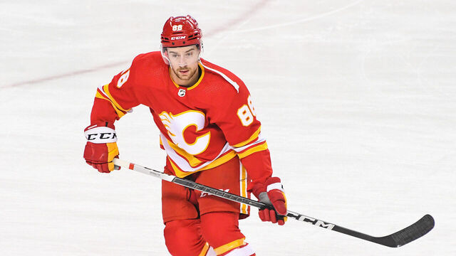 CALGARY, CANADA - FEBRUARY 22: Andrew Mangiapane #88 of the Calgary Flames in action against the Boston Bruins during an NHL game at Scotiabank Saddledome on February 22, 2024 in Calgary, Alberta, Canada.
