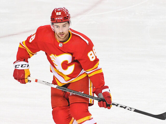 CALGARY, CANADA - FEBRUARY 22: Andrew Mangiapane #88 of the Calgary Flames in action against the Boston Bruins during an NHL game at Scotiabank Saddledome on February 22, 2024 in Calgary, Alberta, Canada.
