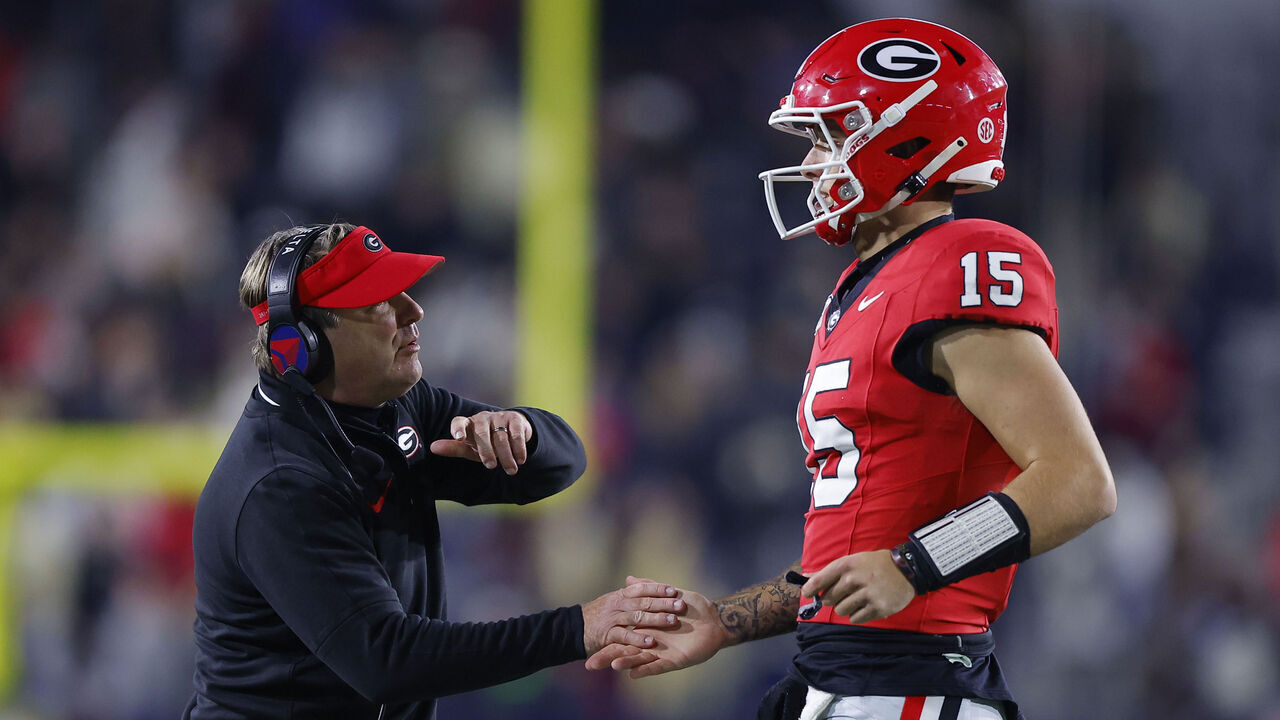 ATLANTA, GEORGIA - NOVEMBER 25: Head coach Kirby Smart reacts with Carson Beck #15 of the Georgia Bulldogs during the fourth quarter against the Georgia Tech Yellow Jackets at Bobby Dodd Stadium on November 25, 2023 in Atlanta, Georgia.