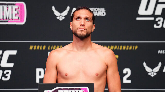 LAS VEGAS, NEVADA - JUNE 28: Brian Ortega poses on the scale during the UFC 303 official weigh-ins at UFC Apex on June 28, 2024 in Las Vegas, Nevada.