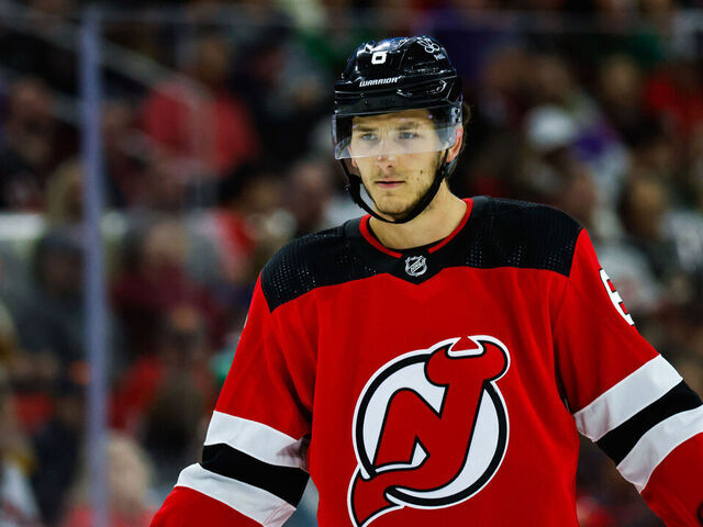 RALEIGH, NC - FEBRUARY 10: John Marino #6 of the New Jersey Devils looks on during the third period of the game against the Carolina Hurricanes at PNC Arena on February 10, 2024 in Raleigh, North Carolina. Hurricanes defeat Devils 1-0.