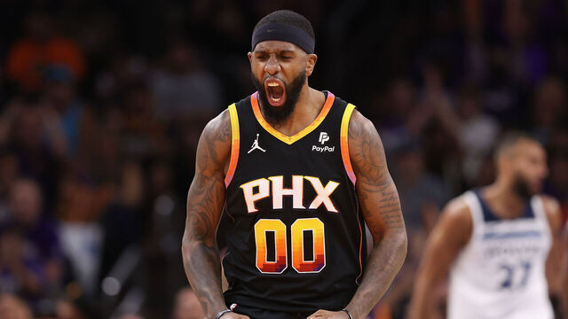 PHOENIX, ARIZONA - APRIL 28: Royce O'Neale #00 of the Phoenix Suns reacts to a three-point shot against the Minnesota Timberwolves during the first half of game four of the Western Conference First Round Playoffs at Footprint Center on April 28, 2024 in Phoenix, Arizona.