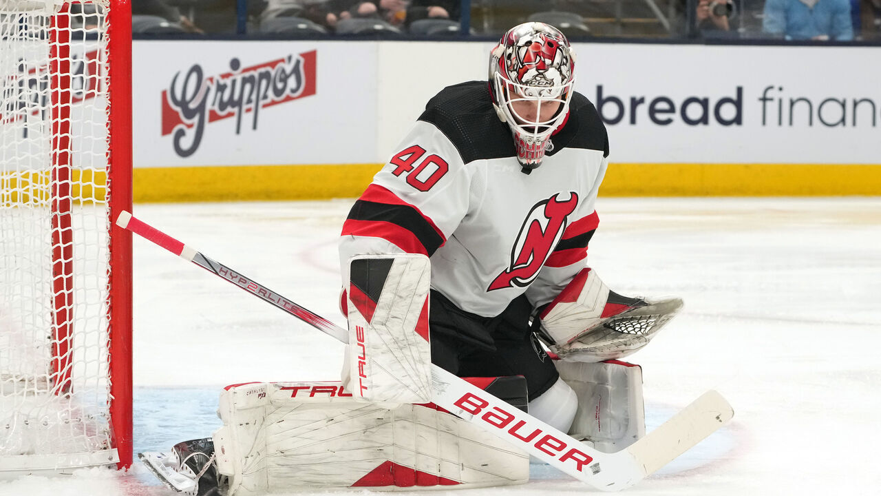 COLUMBUS, OHIO - DECEMBER 16: Akira Schmid #40 of the New Jersey Devils deflects the puck during the second period against the Columbus Blue Jackets at Nationwide Arena on December 16, 2023 in Columbus, Ohio.