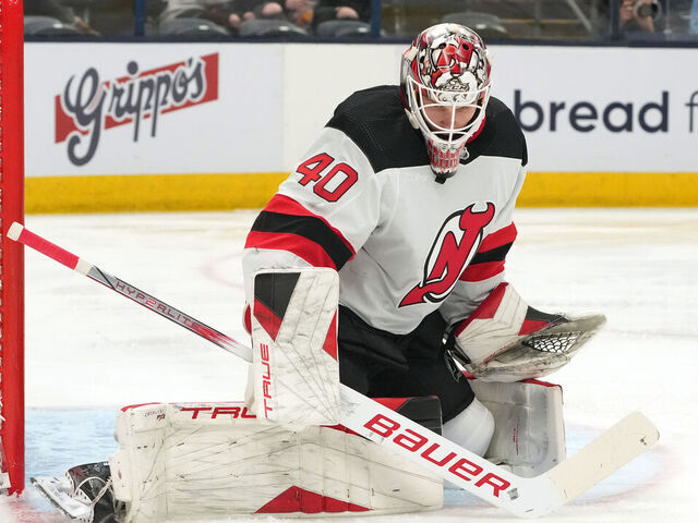 COLUMBUS, OHIO - DECEMBER 16: Akira Schmid #40 of the New Jersey Devils deflects the puck during the second period against the Columbus Blue Jackets at Nationwide Arena on December 16, 2023 in Columbus, Ohio.