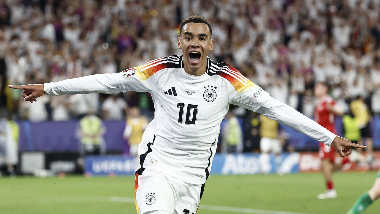 Germany's midfielder #10 Jamal Musiala celebrates scoring his team's second goal during the UEFA Euro 2024 round of 16 football match between Germany and Denmark at the BVB Stadion Dortmund in Dortmund on June 29, 2024.