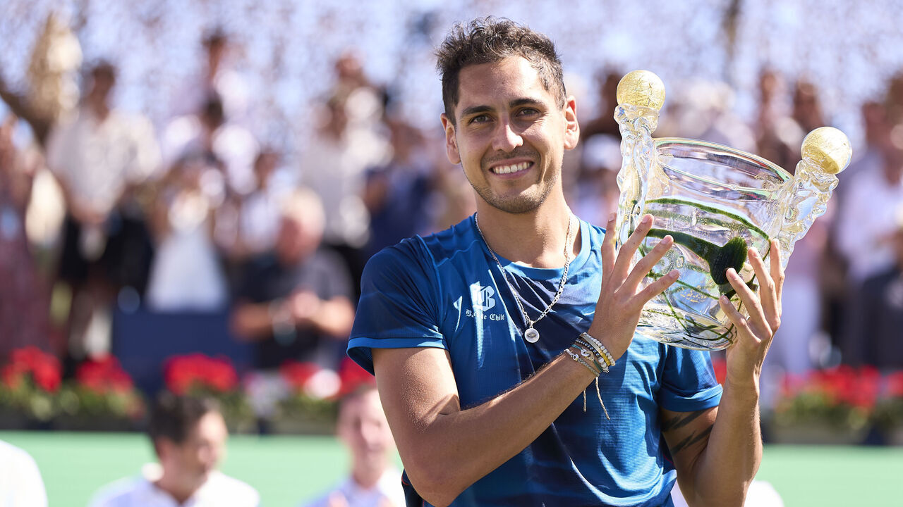 PALMA DE MALLORCA, SPAIN - JUNE 29: Alejandro Tabilo of Chile celebrates with the winners trophy after victory in his final match against Sebastian Ofner of Austria during day seven of the Mallorca Championships at Mallorca Country Club on June 29, 2024 in Palma de Mallorca, Spain.