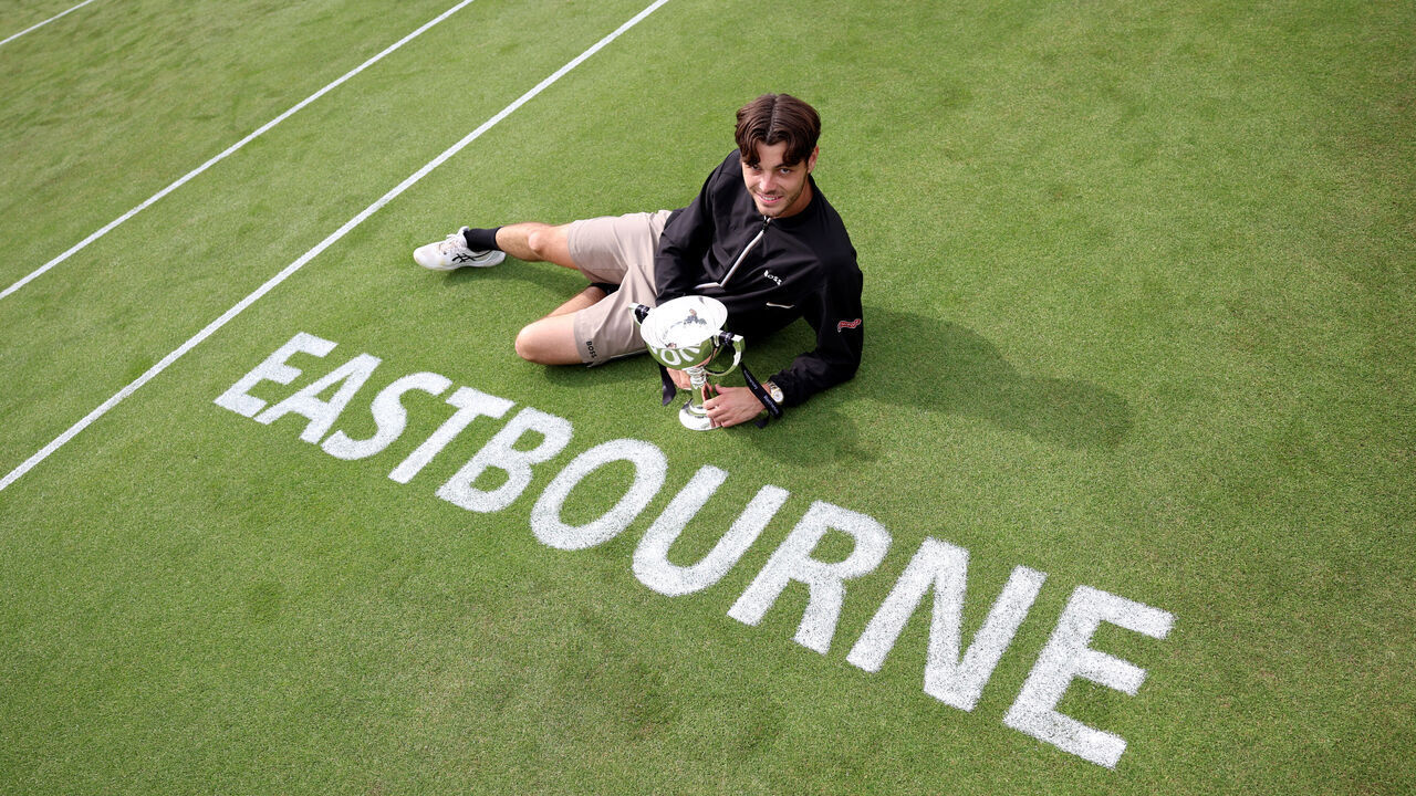 EASTBOURNE, ENGLAND - JUNE 29: Taylor Fritz of United States celebrates with the Rothesay International Eastbourne Men's Singles trophy following victory against Max Purcell of Australia in the Men's Singles Final match on Day Eight of the Rothesay International Eastbourne at Devonshire Park on June 29, 2024 in Eastbourne, England.