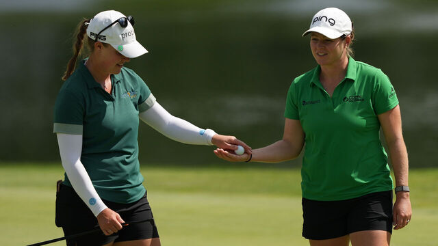 MIDLAND, MICHIGAN - JUNE 29: (L-R) Jennifer Kupcho of the United States hands the ball to Ally Ewing of the United States on the fifth green during the third round of the Dow Championship at Midland Country Club on June 29, 2024 in Midland, Michigan.