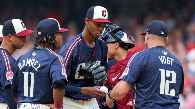 CLEVELAND, OH - JUNE 18: Cleveland Guardians starting pitcher Triston McKenzie (24) hands the baseball to Cleveland Guardians manager Stephen Vogt (12) as he leaves the game during the third inning of the Major League Baseball game between the Seattle Mariners and Cleveland Guardians on June 18, 2024, at Progressive Field in Cleveland, OH.