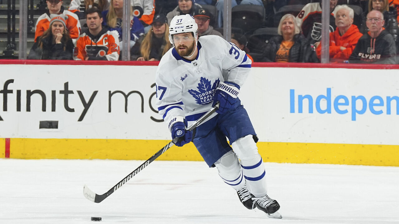PHILADELPHIA, PENNSYLVANIA - MARCH 19: Timothy Liljegren #37 of the Toronto Maple Leafs controls the puck against the Philadelphia Flyers at the Wells Fargo Center on March 19, 2024 in Philadelphia, Pennsylvania. The Flyers defeated the Maple Leafs 4-3.