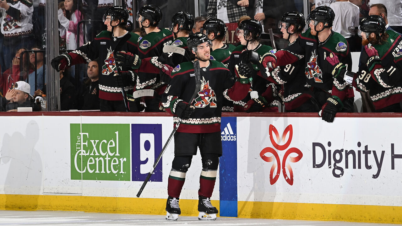 TEMPE, ARIZONA - APRIL 17: Sean Durzi #50 of the Arizona Coyotes celebrates with teammates on the bench after scoring a goal against the Edmonton Oilers during the third period of the game at Mullett Arena on April 17, 2024 in Tempe, Arizona.