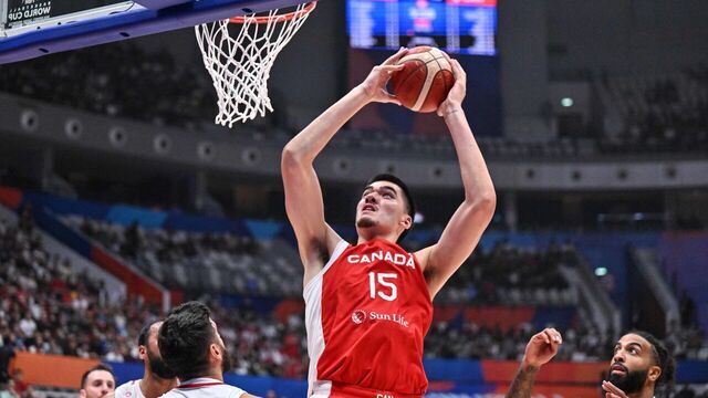 Zach Edey of Canada shoots as Lebanon's players look on during the FIBA Basketball World Cup group H between Canada and Lebanon at Indonesia Arena in Jakarta on August 27, 2023.