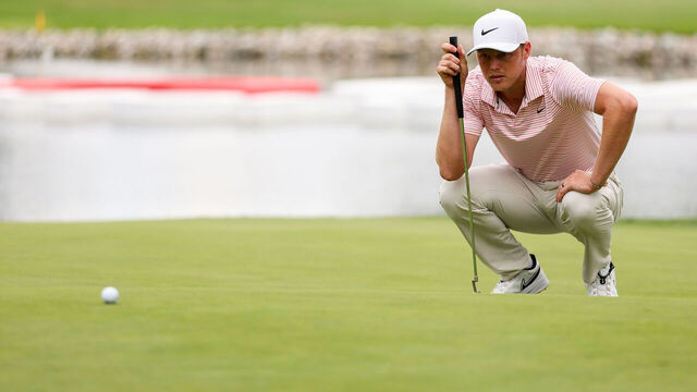 DETROIT, MICHIGAN - JUNE 30: Cameron Davis of Australia lines up a putt on the 14th green during the final round of the Rocket Mortgage Classic at Detroit Golf Club on June 30, 2024 in Detroit, Michigan.