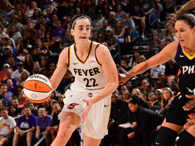 PHOENIX, AZ - JUNE 30: Caitlin Clark #22 of the Indiana Fever dribbles the ball during the game against the Phoenix Mercury on June 30, 2024 at Footprint Center in Phoenix, Arizona. Mandatory Copyright Notice: Copyright 2024 NBAE