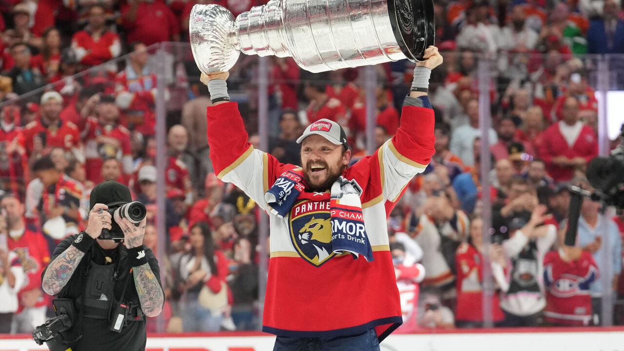 SUNRISE, FL - JUNE 24: Florida Panthers center Sam Reinhart (13) celebrates with the cup following game seven of the Stanley Cup Finals between the Edmonton Oilers and the Florida Panthers on Monday, June 24, 2024 at Amerant Bank Arena in Sunrise, Fla.