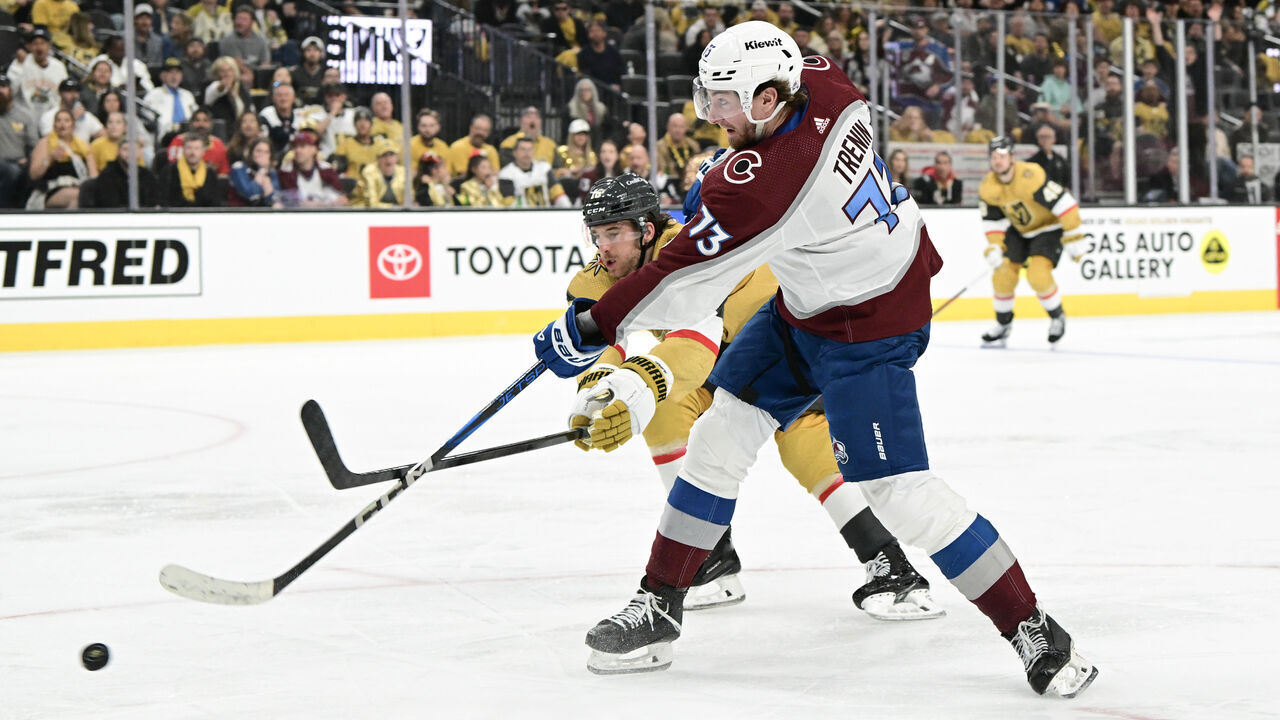 LAS VEGAS, NEVADA - APRIL 14: Yakov Trenin #73 of the Colorado Avalanche takes a shot past Noah Hanifin #15 of the Vegas Golden Knights in third period at T-Mobile Arena on April 14, 2024 in Las Vegas, Nevada. The Golden Knights defeated the Avalanche 4-3 in overtime.