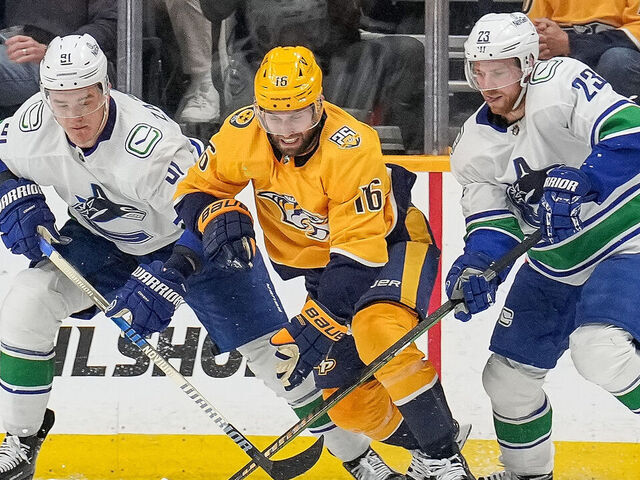 NASHVILLE, TENNESSEE - MAY 3: Jason Zucker #16 of the Nashville Predators battles for the puck against Nikita Zadorov #91 and Elias Lindholm #23 of the Vancouver Canucks in Game Six of the First Round of the 2024 Stanley Cup Playoffs at Bridgestone Arena on May 3, 2024 in Nashville, Tennessee.
