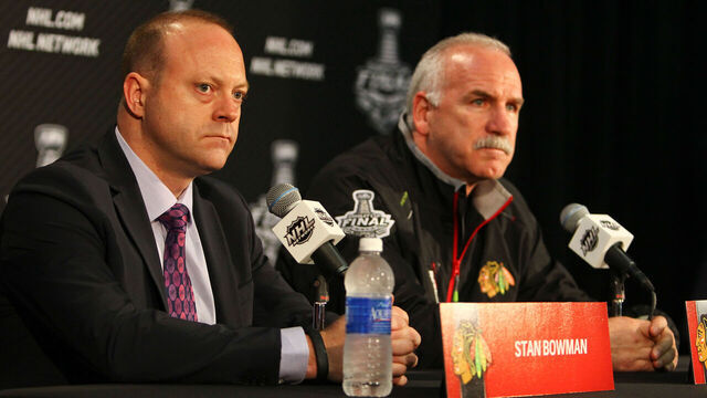 CHICAGO, IL- JUNE 11: Chicago Blackhawks' General Manager Stan Bowman and Head Coach Joel Quenneville speak to the media during the 2013 Stanley Cup Final Media Day at the United Center on June 11, 2013 in Chicago, Illinois.