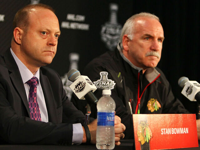 CHICAGO, IL- JUNE 11: Chicago Blackhawks' General Manager Stan Bowman and Head Coach Joel Quenneville speak to the media during the 2013 Stanley Cup Final Media Day at the United Center on June 11, 2013 in Chicago, Illinois.