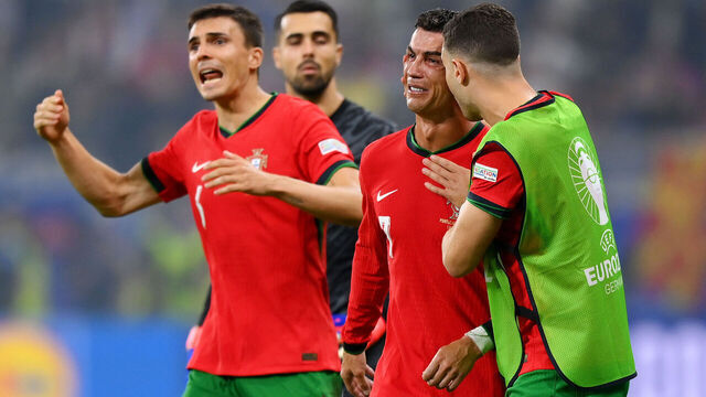 FRANKFURT AM MAIN, GERMANY - JULY 01: Cristiano Ronaldo of Portugal looks dejected as he is consoled by teammates ahead of the second half of extra-time during the UEFA EURO 2024 round of 16 match between Portugal and Slovenia at Frankfurt Arena on July 01, 2024 in Frankfurt am Main, Germany.