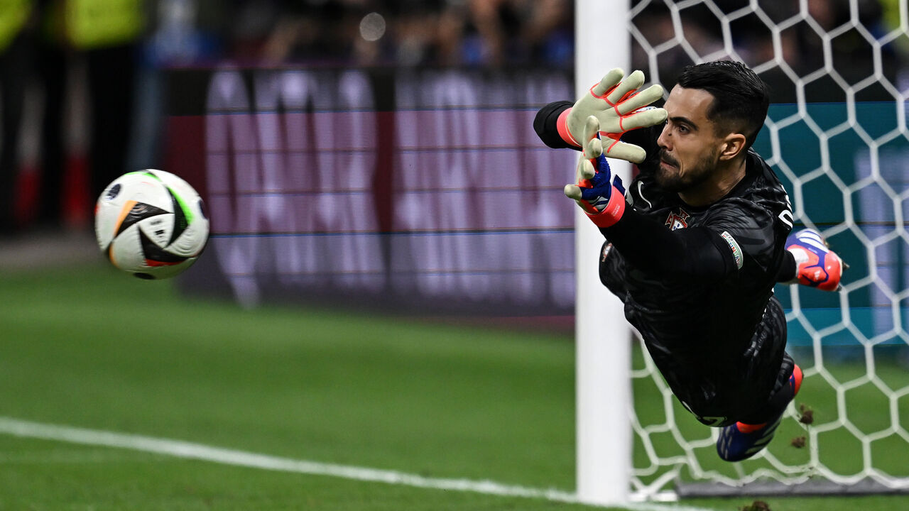 FRANKFURT AM MAIN, GERMANY - JULY 01: Diogo Costa of Portugal saves the penalty during the UEFA EURO 2024 round of 16 match between Portugal and Slovenia at Frankfurt Arena on July 01, 2024 in Frankfurt am Main, Germany.